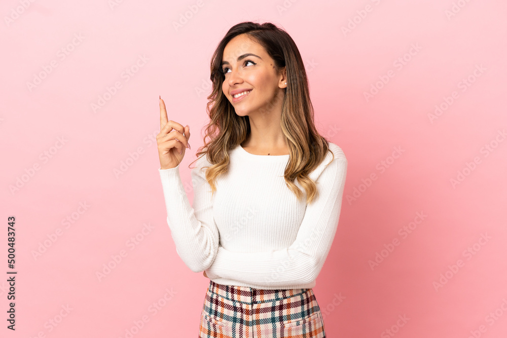 Young woman over isolated background pointing up a great idea Young woman over isolated background pointing up a great idea
