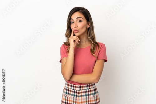 Young woman over isolated background and thinking