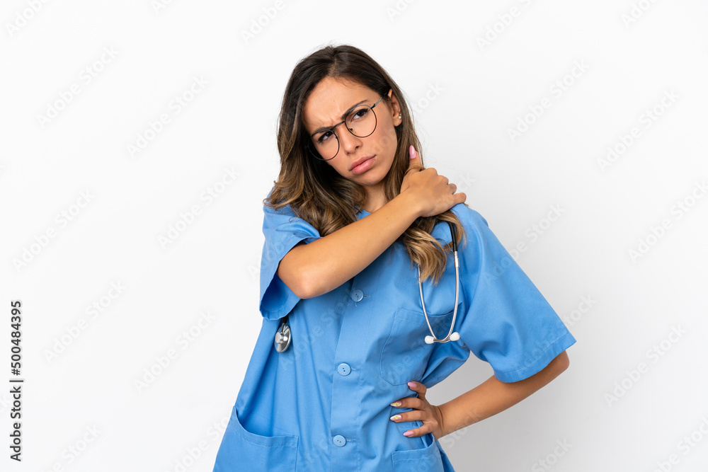 Young surgeon doctor woman over isolated white wall suffering from pain in shoulder for having made an effort Young surgeon doctor woman over isolated white wall suffering from pain in shoulder for having made an effort