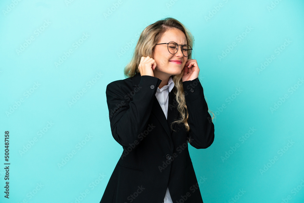 Brazilian business woman over isolated background frustrated and covering ears Brazilian business woman over isolated background frustrated and covering ears