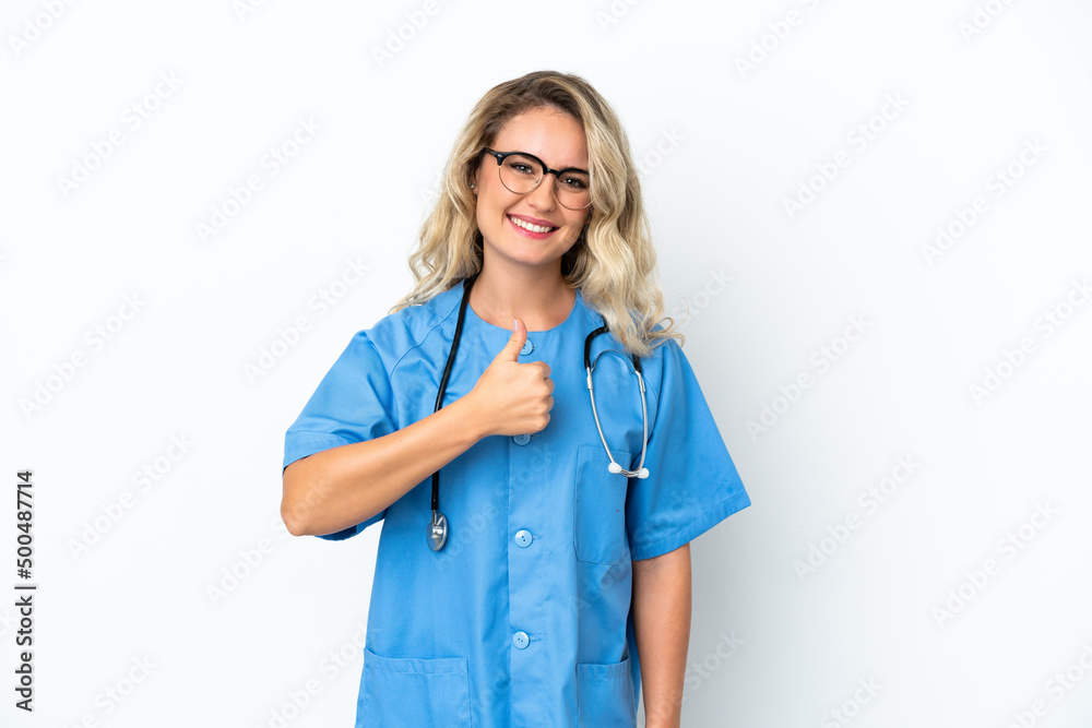 Brazilian surgeon doctor woman over isolated background giving a thumbs up gesture Brazilian surgeon doctor woman over isolated background giving a thumbs up gesture