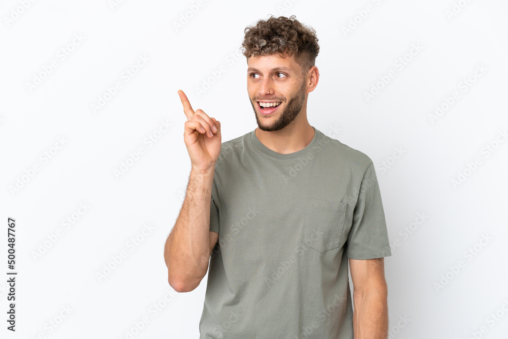 Young caucasian handsome man isolated on white background intending to realizes the solution while lifting a finger up Young caucasian handsome man isolated on white background intending to realizes the solution while lifting a finger up