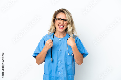 Brazilian surgeon doctor woman over isolated background celebrating a victory in winner position