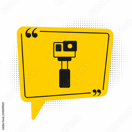 Black Action extreme camera icon isolated on white background. Video camera equipment for filming extreme sports. Yellow speech bubble symbol. Vector