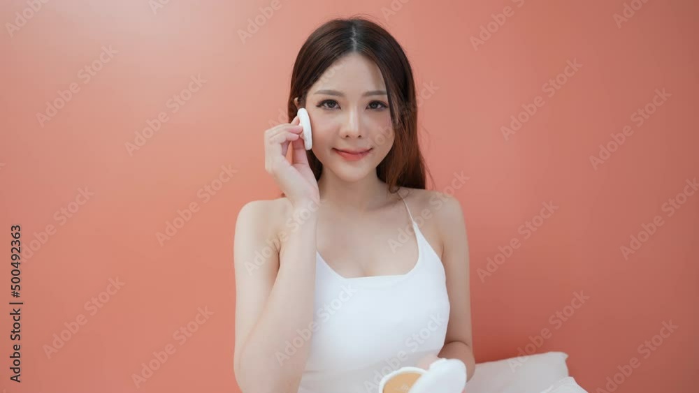 Holiday concept of 4k Resolution. Asian girls make makeup on the bed in the bedroom. Holiday concept of 4k Resolution. Asian girls make makeup on the bed in the bedroom.