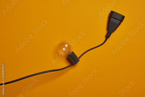 Small spotlight on yellow background. Ideas. Wires with focus.