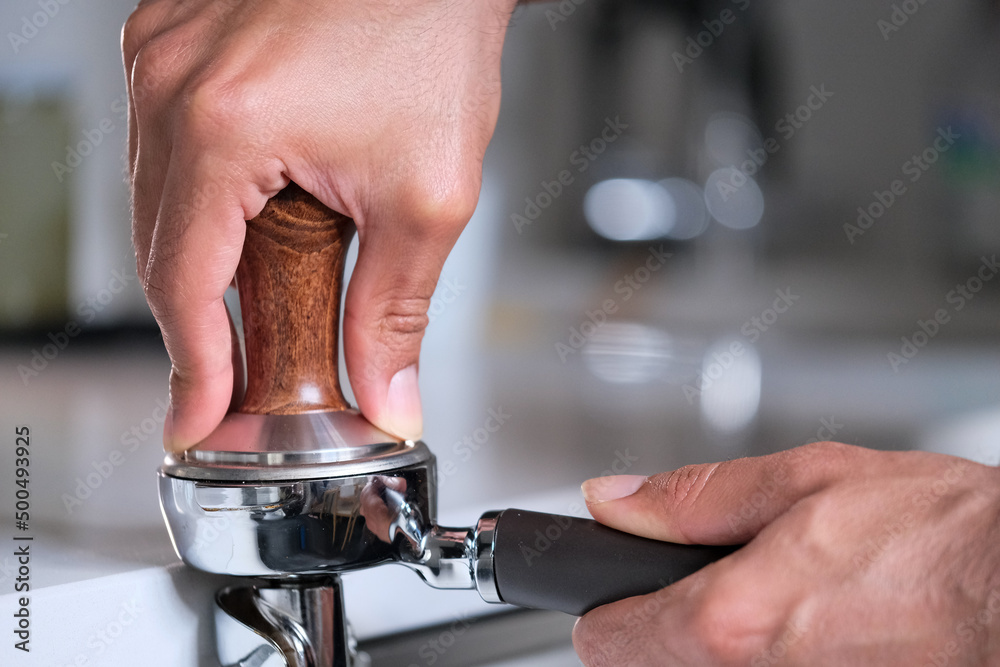 person holding a coffee press