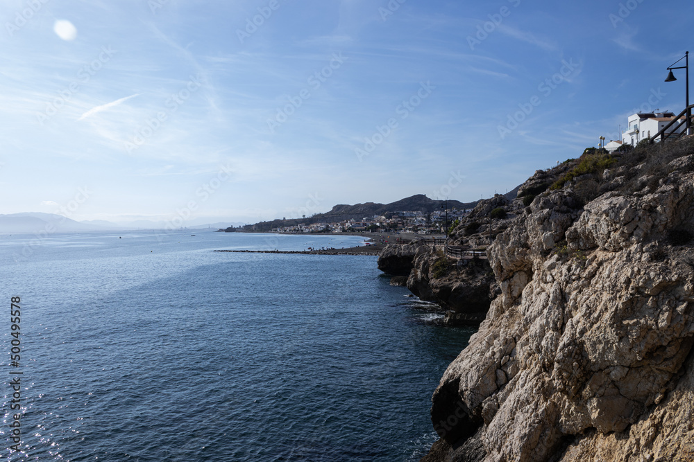 cliffs in the mediterranean sea with clear water, blue sky and calm sea