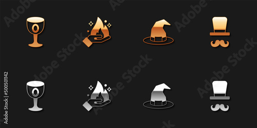 Set Medieval goblet, Hand holding fire, Witch hat and Magician icon. Vector