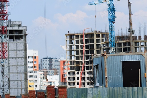 The architectural complex of residential buildings on sky background