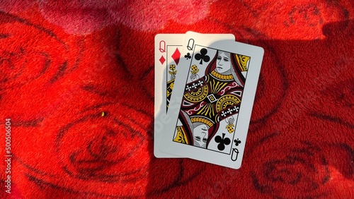 Casino playing card on the table isolation background at Casino Border, Kampong Rou District, Svay Reing Province, Cambodia, Casino element, Casino poker over red background.