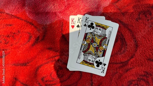 Casino playing card on the table isolation background at Casino Border, Kampong Rou District, Svay Reing Province, Cambodia, Casino element, Casino poker over red background.
