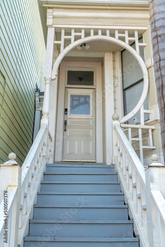 Wooden doorsteps with white handrails of a house at San Francisco, California