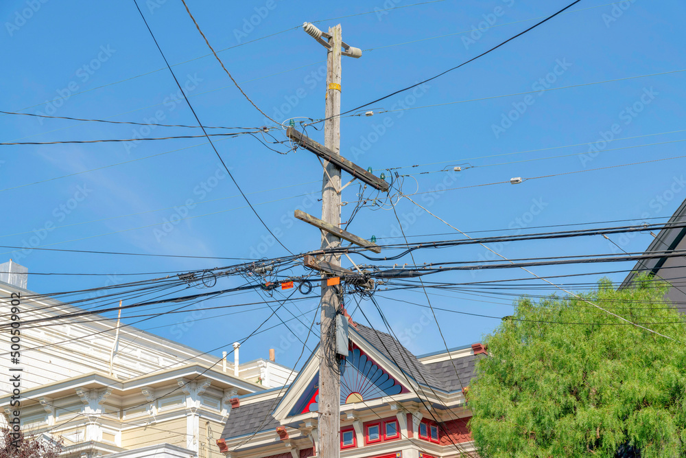 Electrical post with entangled cable wires in a residential area in San Francisco, California