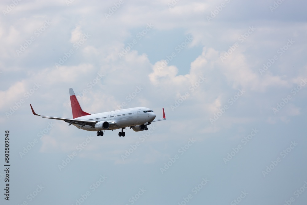 Airplane flying above clouds in beautiful sky. Travel concept. Airplane flying above clouds in beautiful sky. Travel concept.