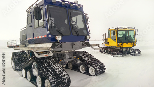 Картината върху платно Two vehicles with four tracked wheels in the winter on the north slope, Alaska d