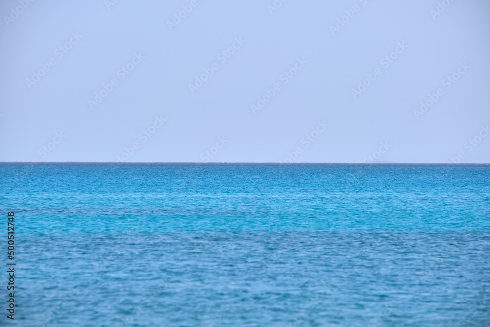 Closeup seascape surface of blue sea water with small ripple waves