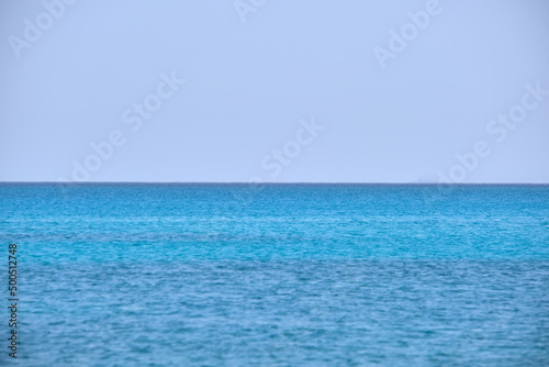 Closeup seascape surface of blue sea water with small ripple waves