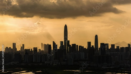 Time lapse of silhouette of Skyline of Shenzhen city, China. Viewed from Hong Kong