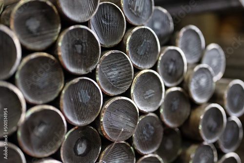 A bundle of round metal bars, steel mill products © nordroden