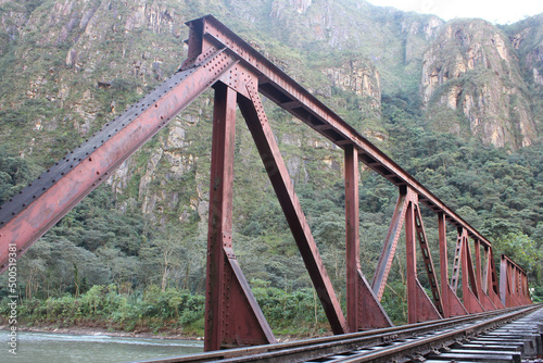 Detalhe de uma ponte férrea sobre o rio Urubamba no Peru photo