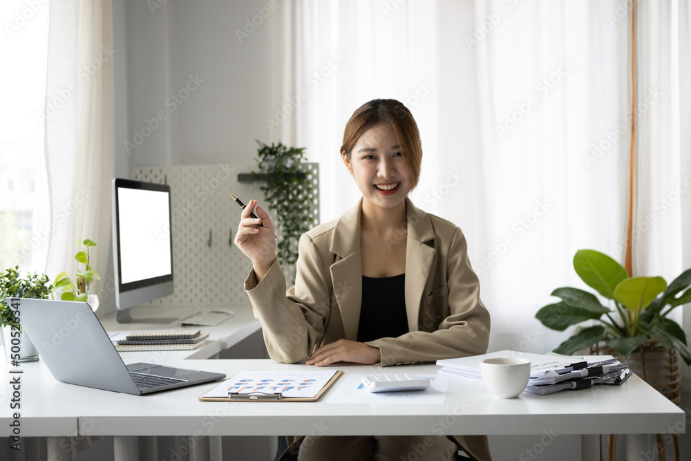 Happy young woman freelancer sitting in home office and smiling to camera. Happy young woman freelancer sitting in home office and smiling to camera.