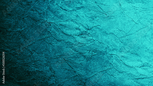 Blue green abstract background. Gradient. Toned rough cracked stone surface. Teal background with space for design.