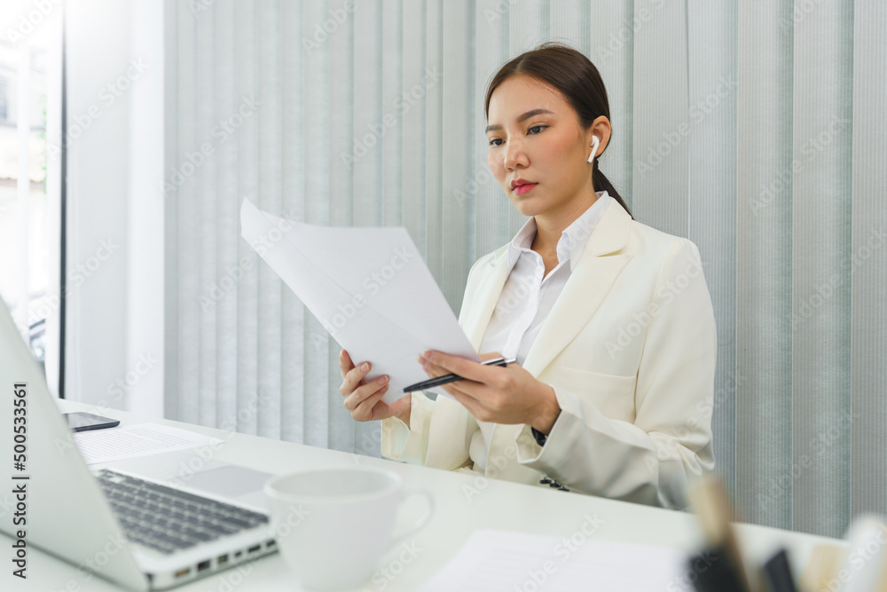 Confidence woman concept, Businesswoman read financial data to analyzing for strategy of business Confidence woman concept, Businesswoman read financial data to analyzing for strategy of business
