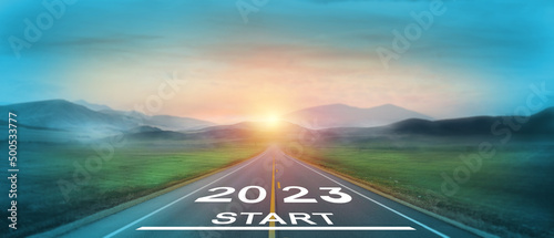 New start of the new year 2023. Starting to new year. 2023 written on the road in the middle of asphalt road at sunset. Goals,plan,opportunity and new business or life changing for the next year.