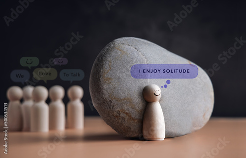 Psychology Personality Concept. Introvert Person. person who Happy and Enjoy by Solitude, Spent Time alone . presenting by wooden peg dolls photo