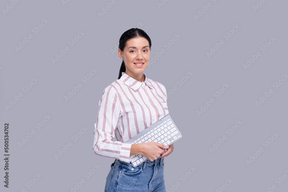 Girl Office Worker Holding Keyboard in Hands Girl Isolated. Office Concept Girl Office Worker Holding Keyboard in Hands Girl Isolated. Office Concept
