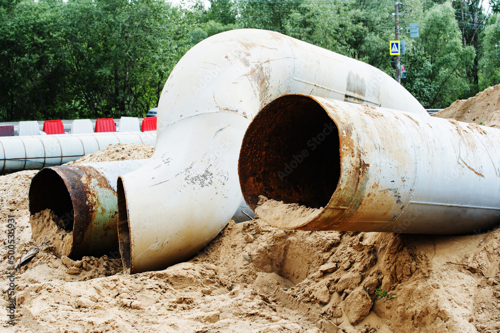 Decompose Pipe Old, dismantled industrial heating pipes. Replacement of worn parts of ...