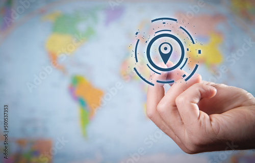 Male hand showing Gps concept on world map background. Location