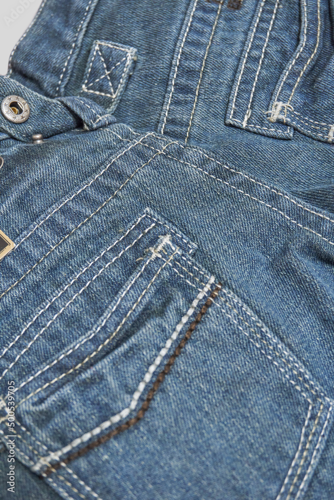 Fototapeta premium Close-up jeans, clothing details, back pockets, soft selective selective focus