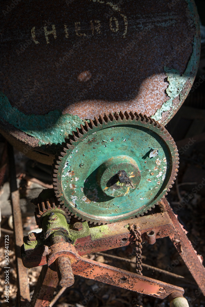 Gear. At the junkyard. Perished agricultural history. Abandoned and rusted machinery. 