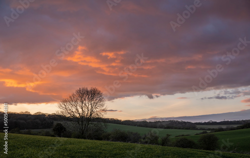Colourful orange sunset sky over the south downs near Lewes East Sussex  south east England
