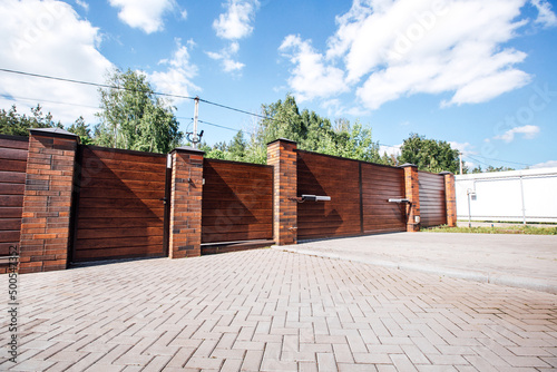 modern fence with automatic gate