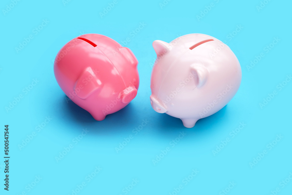 Pink piggy bank on blue background. Pink piggy bank on blue background.