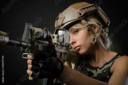 Cuadro en lienzo a girl soldier armed with an automatic rifle takes aim