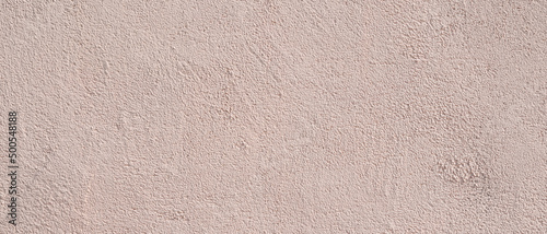 Surface texture of pink concrete wall, cement pattern with cracks on the background with space to copy, panoramic view