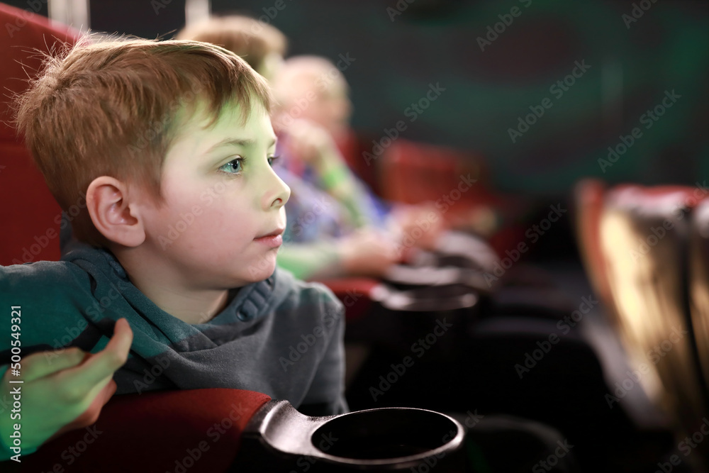 Boy watching movie in cinema Boy watching movie in cinema