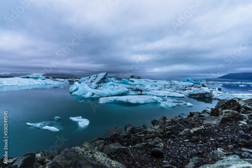 Jokulsarlon lagoon icebergs under cloudy sky