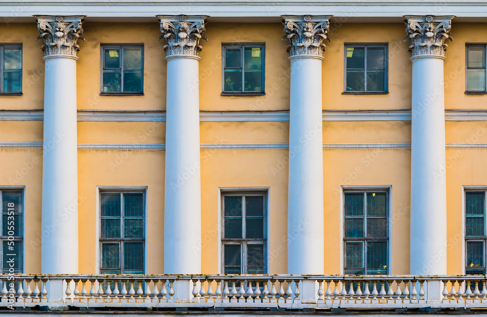 Columns and many windows in a row on the facade of the urban historic apartment building front view, Saint Petersburg, Russia
Columns and many windows in a row on the facade of the urban historic apartment building front view, Saint Petersburg, Russia