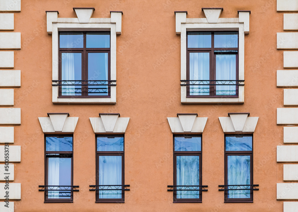 Several windows in a row on the facade of the modern urban apartment building front view, Krasnaya Polyana, Sochi, Krasnodar Krai, Russia
