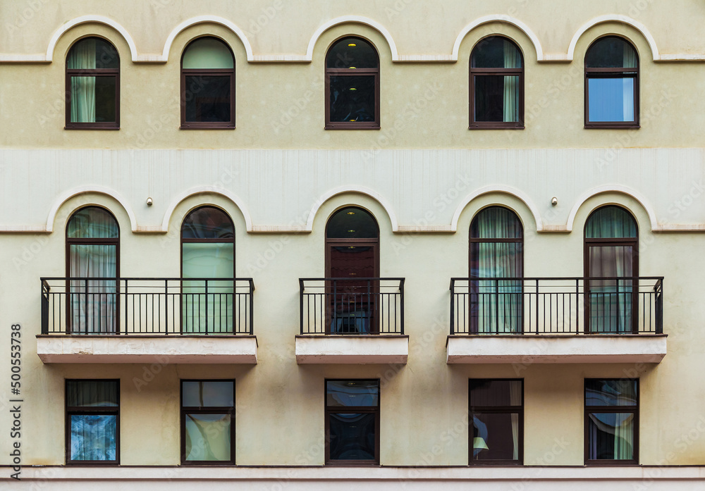 Three balconies and many windows in a row on the facade of the modern urban apartment building front view, Krasnaya Polyana, Sochi, Krasnodar Krai, Russia
Three balconies and many windows in a row on the facade of the modern urban apartment building front view, Krasnaya Polyana, Sochi, Krasnodar Krai, Russia
