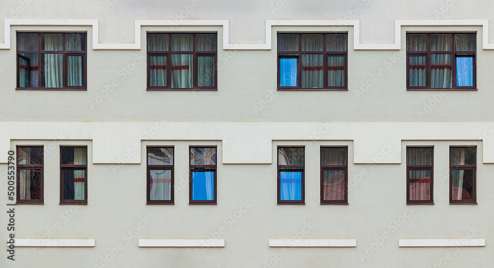 Many windows in a row on the facade of the modern urban apartment building front view, Krasnaya Polyana, Sochi, Krasnodar Krai, Russia
Many windows in a row on the facade of the modern urban apartment building front view, Krasnaya Polyana, Sochi, Krasnodar Krai, Russia