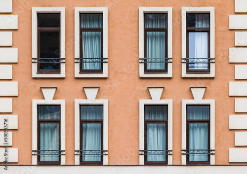 Several windows in a row on the facade of the modern urban apartment building front view, Krasnaya Polyana, Sochi, Krasnodar Krai, Russia  © dr_verner