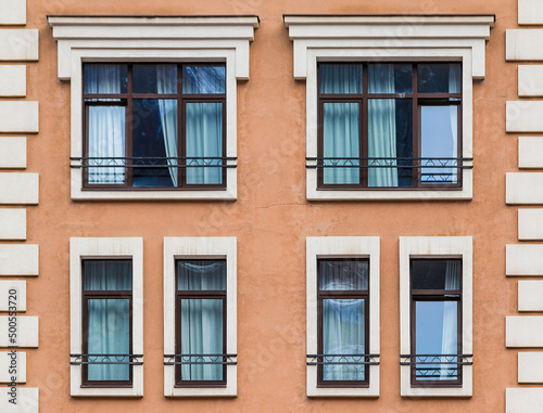 Several windows in a row on the facade of the modern urban apartment building front view, Krasnaya Polyana, Sochi, Krasnodar Krai, Russia 