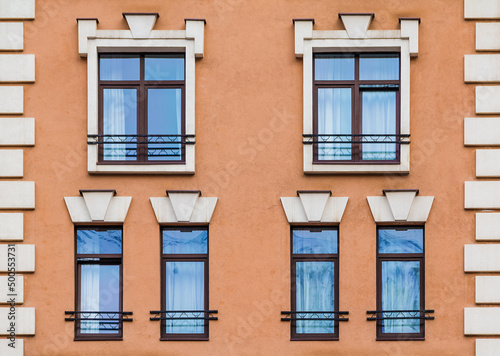 Several windows in a row on the facade of the modern urban apartment building front view, Krasnaya Polyana, Sochi, Krasnodar Krai, Russia 