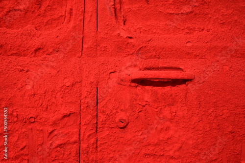 Photography A car door and window applied with a red pigment made form powdered red lead